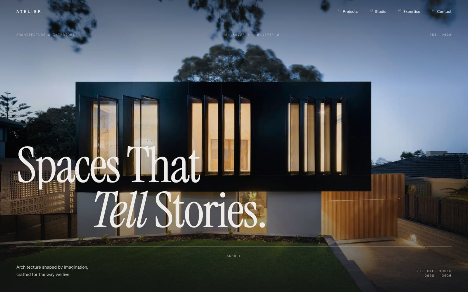 Atelier homepage: “Spaces That Tell Stories” in a large serif over a dusk photograph of a black timber house